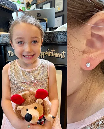 kid ear piercing closeup
