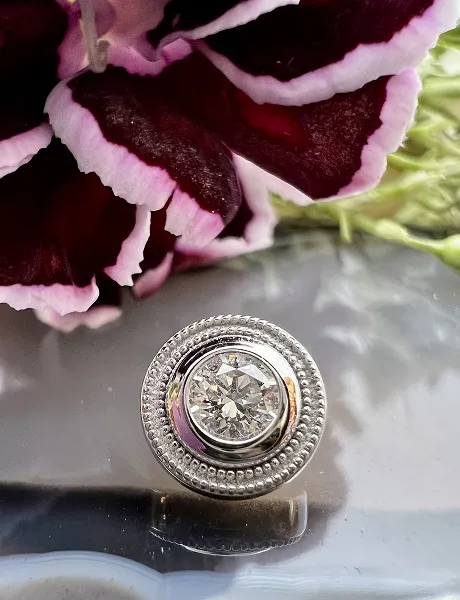 purple flower with silver jewelry display